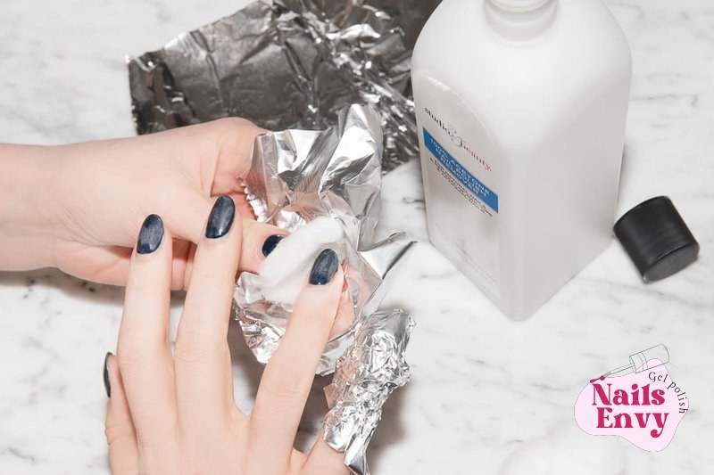 Gel Polish Removal At Home Tips A person demonstrates how to remove a gel manicure