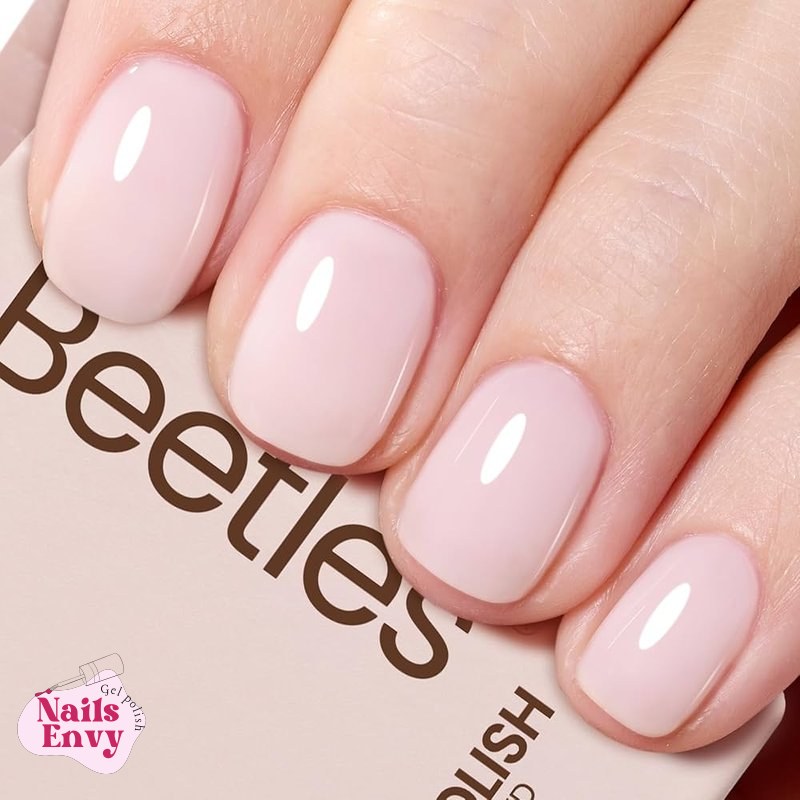 Pink gel nail polish elevates your style A bottle of Beetles Milky Pink Gel Nail Polish, 15ml, a translucent sheer base color.